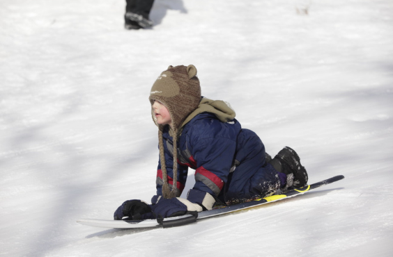 Child sliding at Centennial Park
